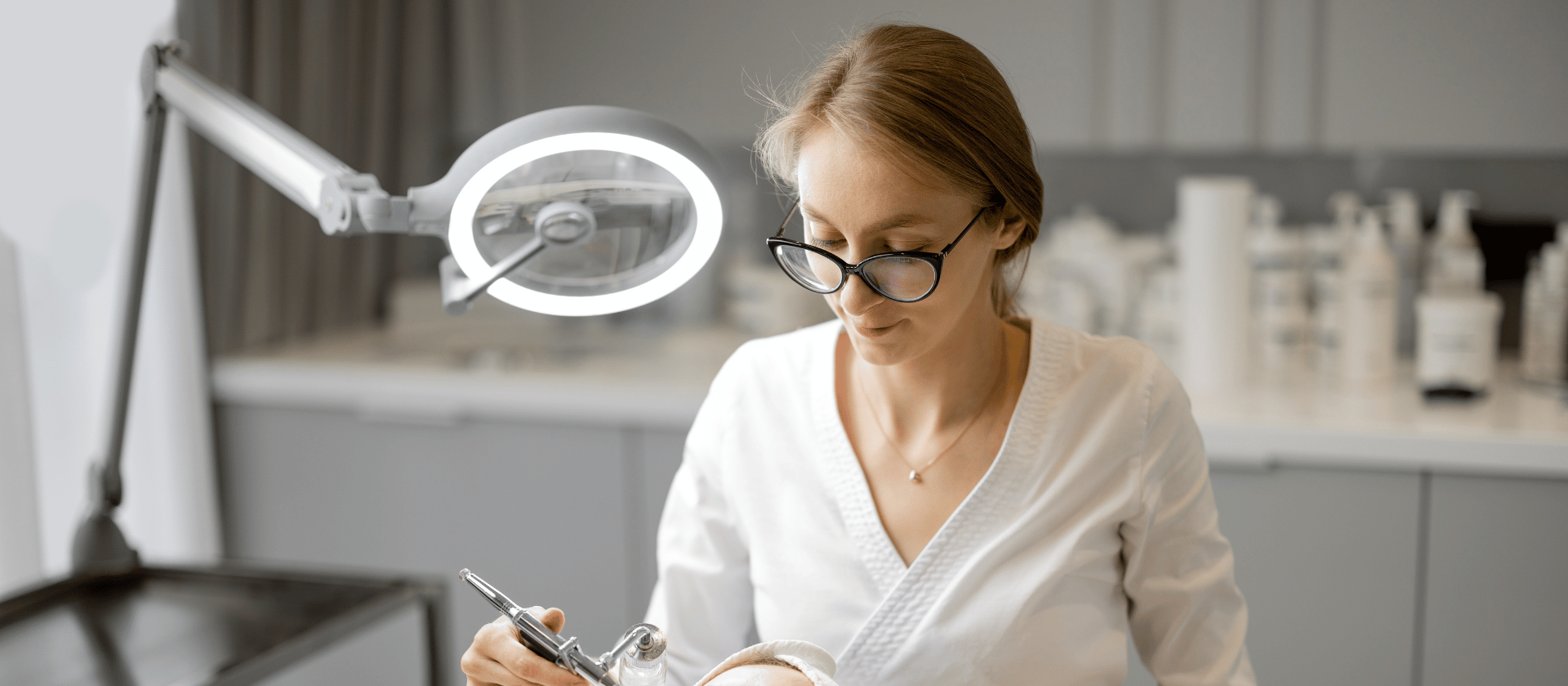 A dermatologist performing a service on a patient.