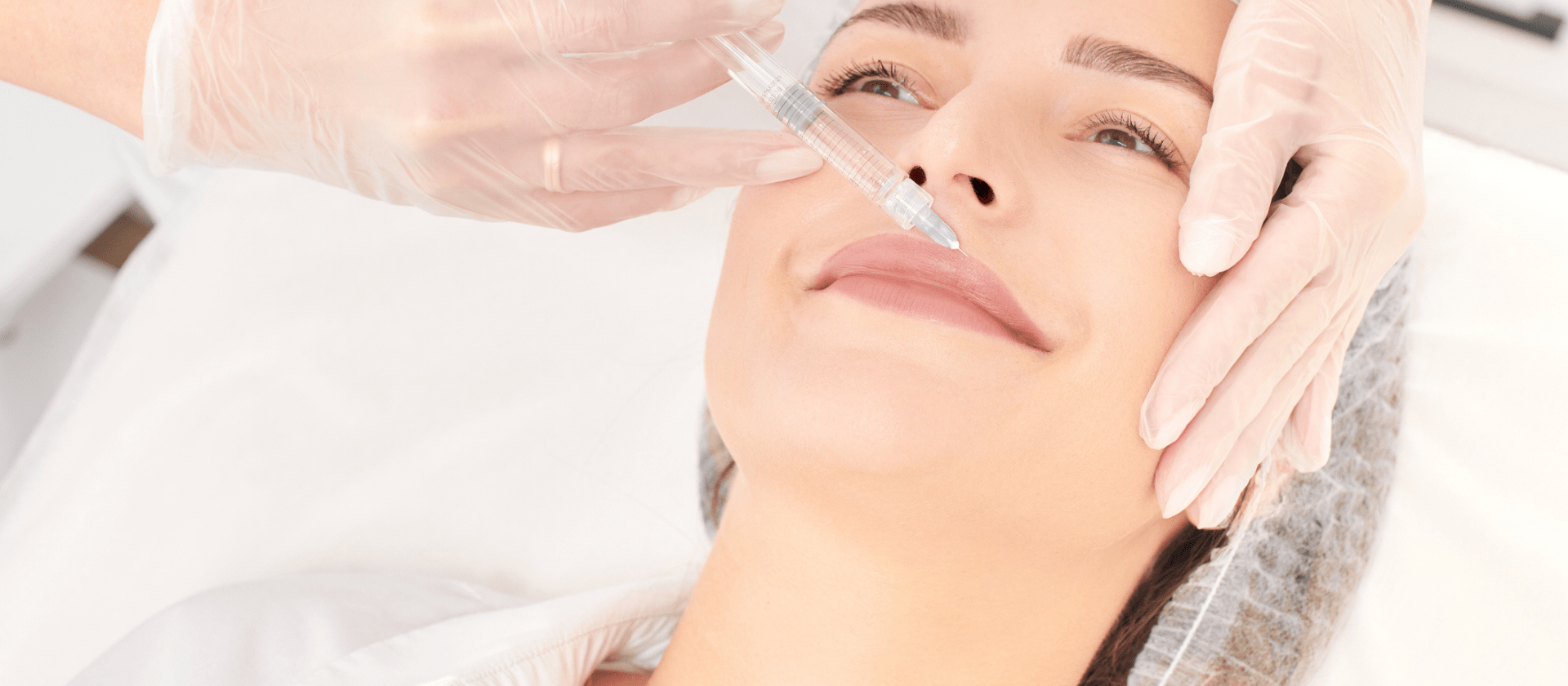 woman receiving lip injections close up