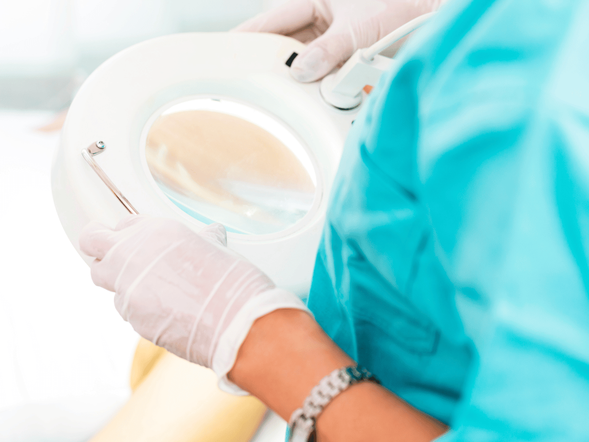 A Mohs fellow setting up the surgical room for a Mohs surgery procedure.